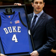 Former Duke University Blue Devil J.J. Reddick holds his jersey after it was retired during halftime of Duke’s game against the Florida State Seminoles at Cameron Indoor Stadium Feb. 4, 2007, in Durham, N.C.
Streeter Lecka/Getty Images